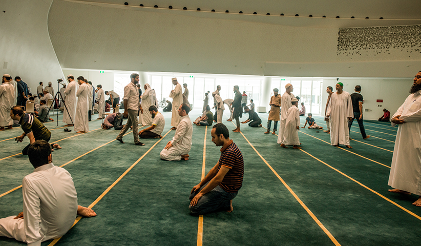 Men at morning prayer in the mosque of the Faculty of Islamic Studies in Doha