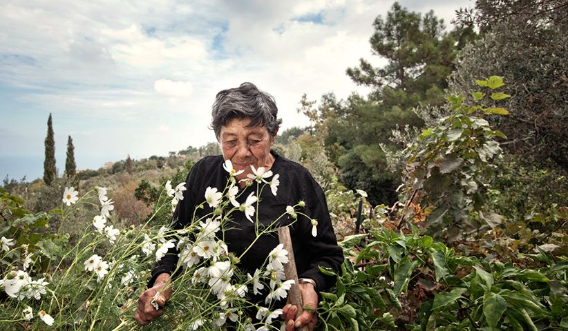 85-year-old Katina Parikos takes care of her garden in the village Karies on the island of Ikaria