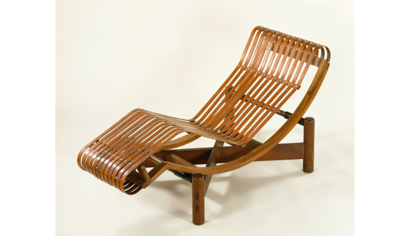 A chaise longe made of brown wood.